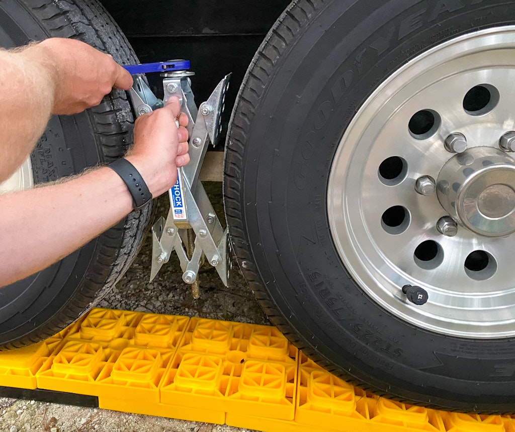 setting up your campsite putting on wheel chocks