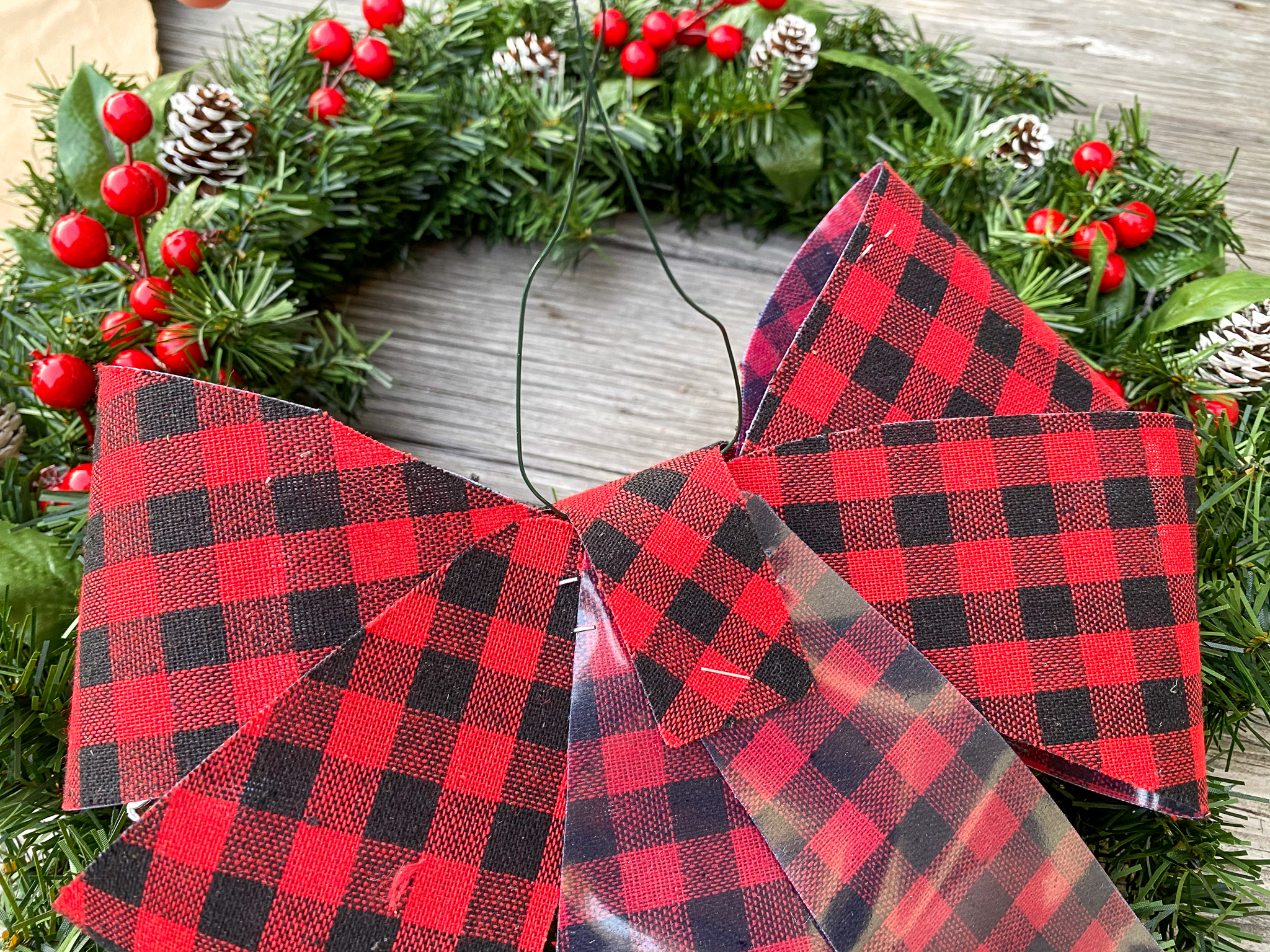 how to add a bow to. a christmas wreath
