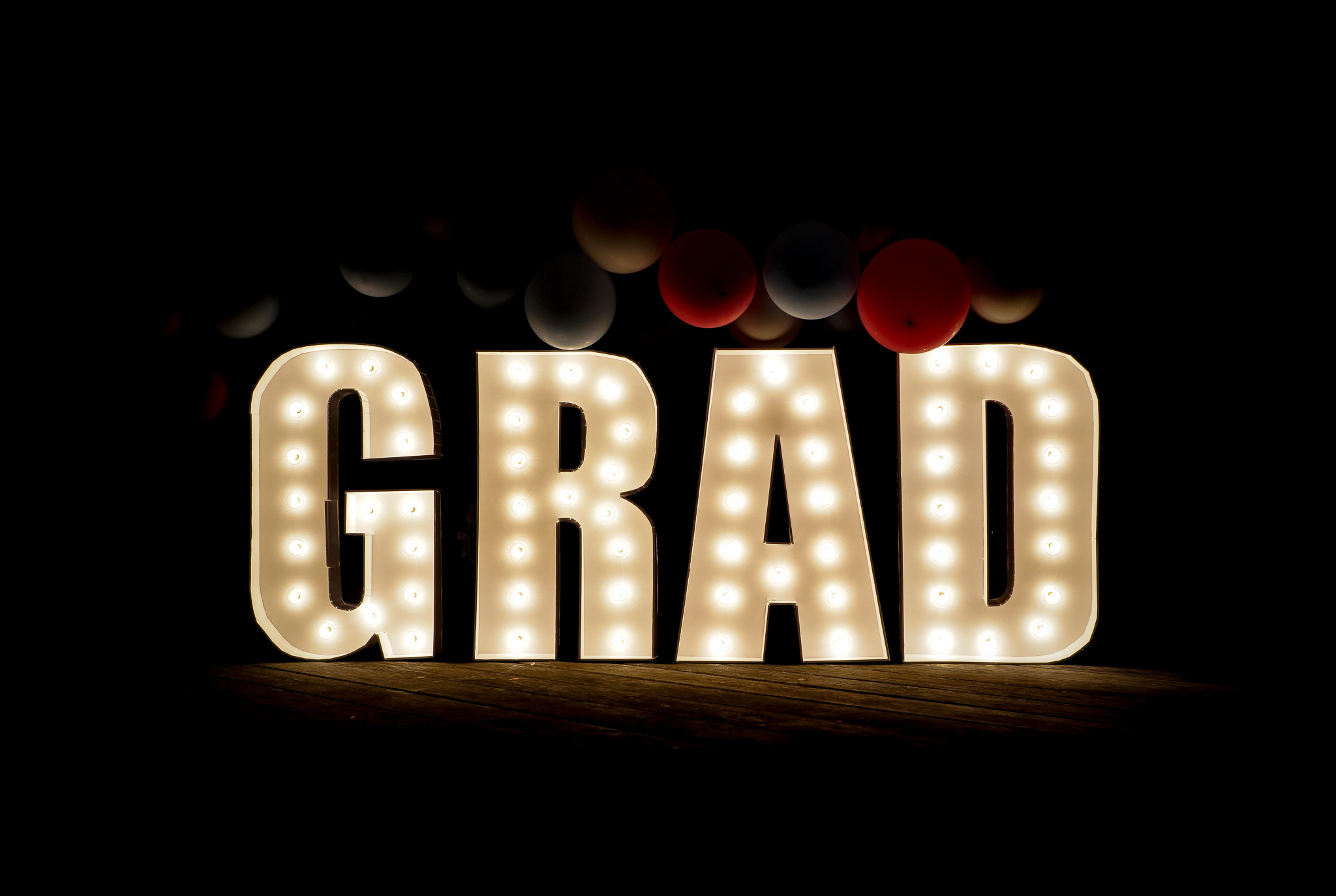 grad letters with lights