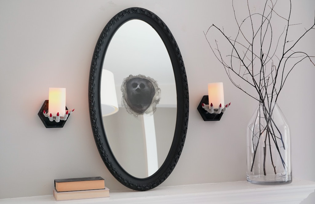 halloween decoration spooky face in mirror